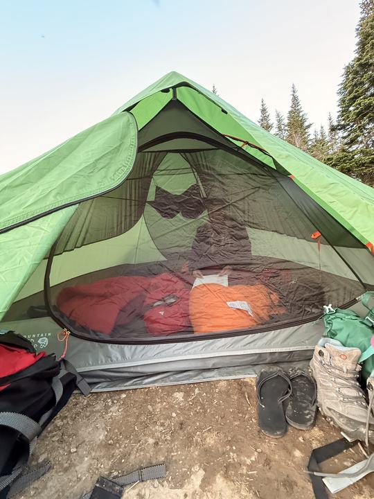 Sleeping bags laid out inside the tent at Windfall Lake