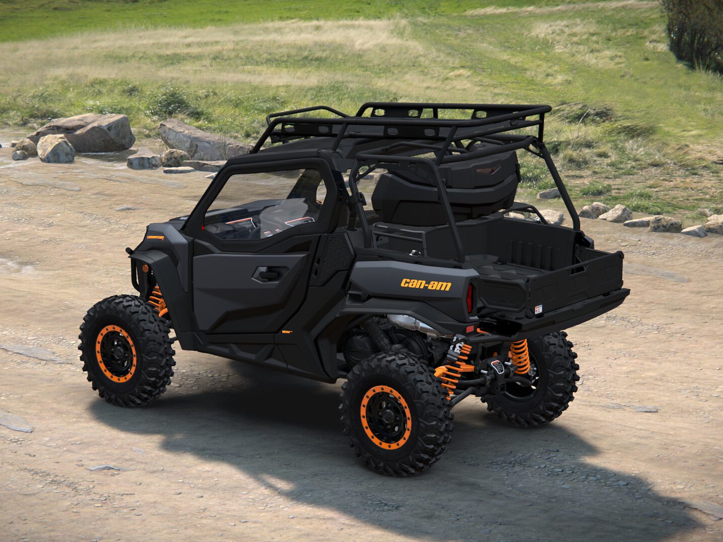 The built Can-Am Commander XT-P from the rear three-quarter, showing the roof rack, rear luggage rack with trunk box, and the extended cargo bed
