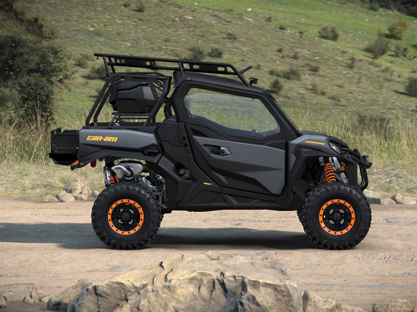 The built Can-Am Commander XT-P in side profile, showing the soft doors, rock sliders, and beadlock wheels