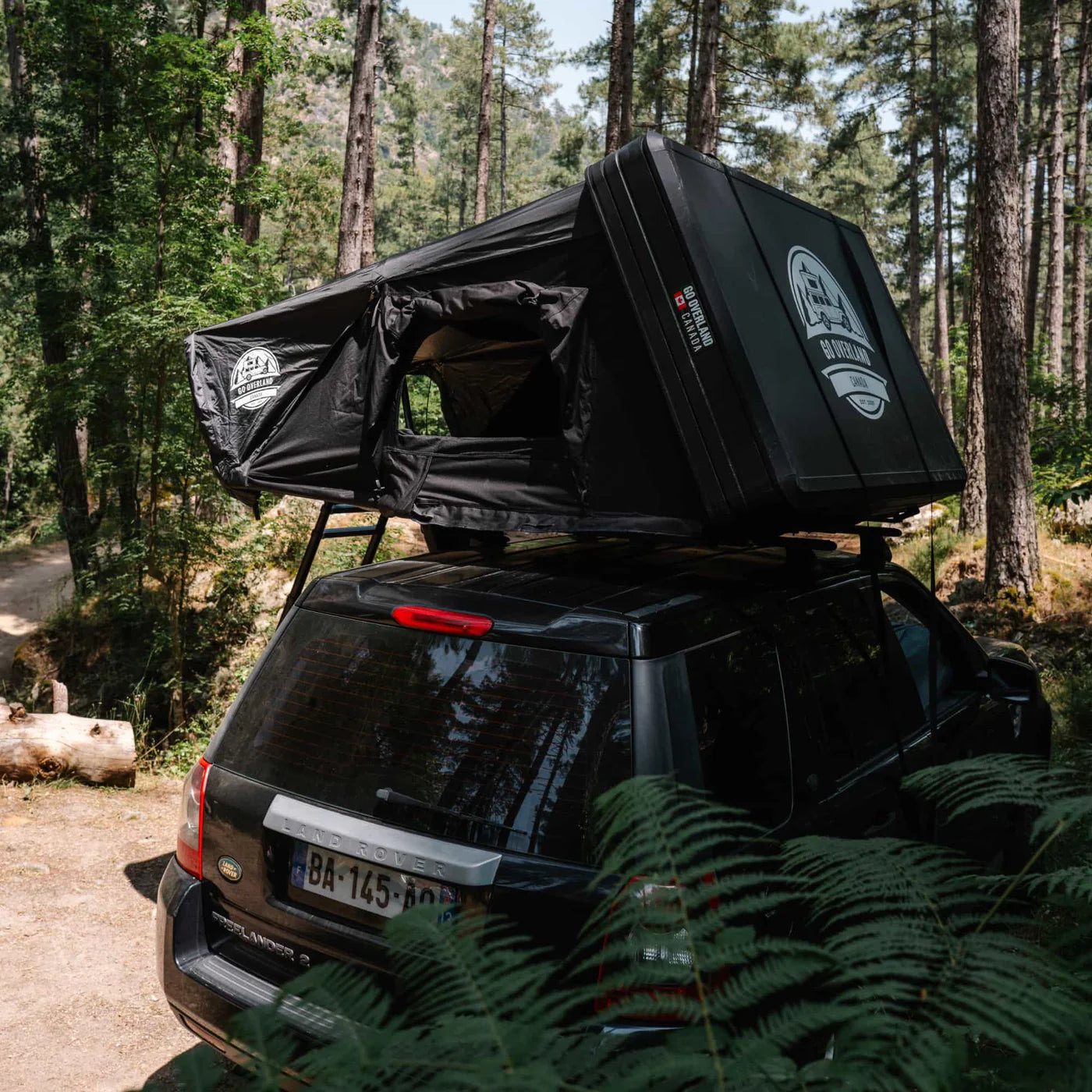 An Expedition L open on an SUV in the forest