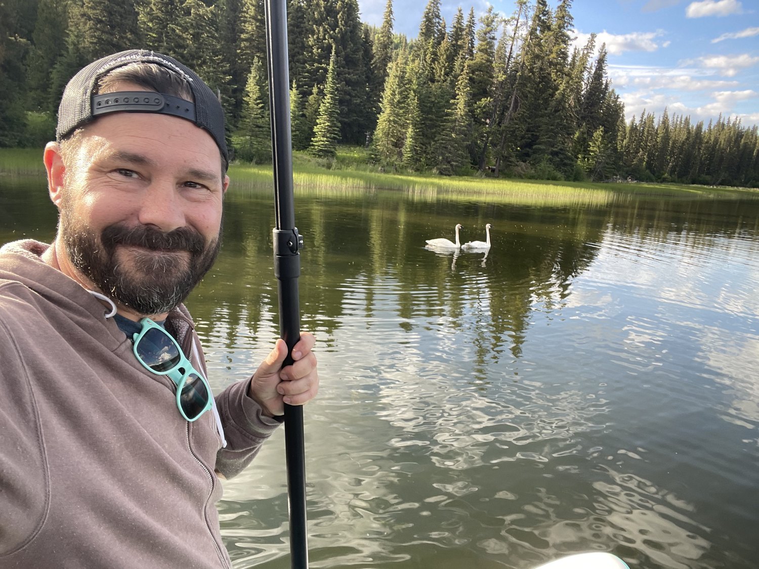 Ryan Blais paddleboarding on a backcountry lake