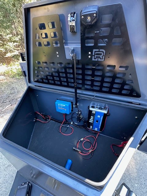 The jockey box on a Rove Recon opened to show the Bluetti power system and wiring